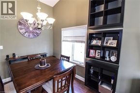 Beamsville apartment for rent - A dining room with a wooden table and chairs.
