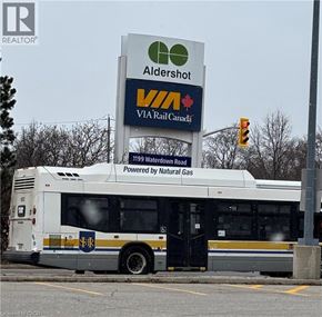 Burlington condo for rent - A white bus with a sign that says Aldershot VIA Rail Canada.