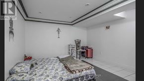Toronto (Woburn) apartment for rent - A bedroom with a bed, a chair, and a table.