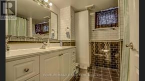 Toronto (Woburn) apartment for rent - A bathroom with a white sink and a tiled shower.