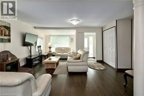 Wasaga Beach apartment for rent - A living room with a white couch and a wooden coffee table.