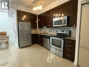 Vaughan (Beverley Glen) condo for rent - A kitchen with a refrigerator, oven, and microwave.