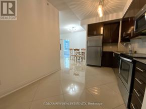 Vaughan (Beverley Glen) condo for rent - A spacious kitchen with a dining table and chairs in the background.