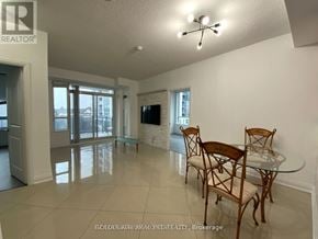 Vaughan (Beverley Glen) condo for rent - A dining room with a glass table and chairs.