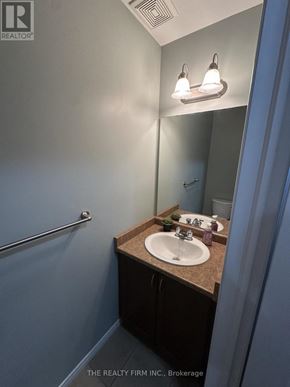London East (East D) townhouse for rent - A bathroom with a sink and a mirror.