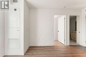 Vaughan (Vaughan Corporate Centre) condo for rent - A white room with a doorway leading to another room.