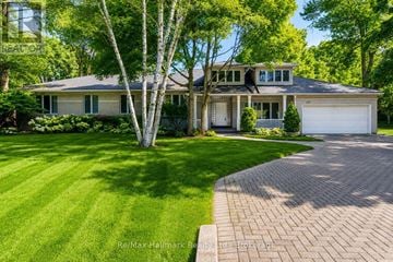 Oakville (Mo Morrison) apartment for rent - A large house with a driveway in front of it.