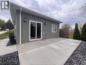 Harrow apartment for rent - A grey house with a white door and windows is for sale.
