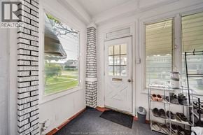 Windsor apartment for rent - A white door with a black mat in front of it.
