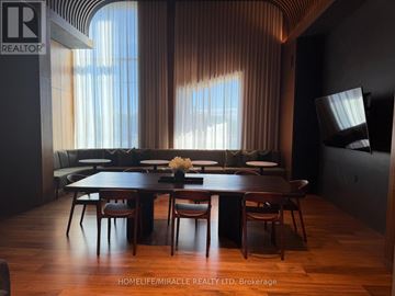 Oakville (Jm Joshua Meadows) condo for rent - A dining room with a wooden table and chairs.