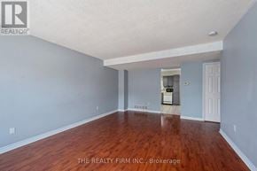 London East (East I) townhouse for rent - A room with wooden floors and a white ceiling.