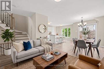 Ottawa townhouse for rent - A living room with a grey couch and a wooden coffee table.