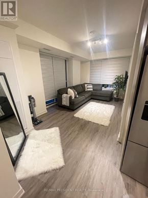 Grimsby (Grimsby Beach) condo for rent - A living room with a grey couch and a white rug.