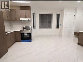 North Vancouver apartment for rent - A kitchen with a white marble floor and a blue dishwasher.