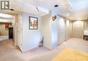 North Vancouver apartment for rent - A room with a yellow rug and a painting on the wall.