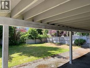 North Vancouver apartment for rent - A concrete pillar with a REALTOR sign on it.