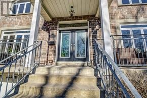 Mississauga (Lakeview) apartment for rent - A house entrance with a glass door and a metal railing.