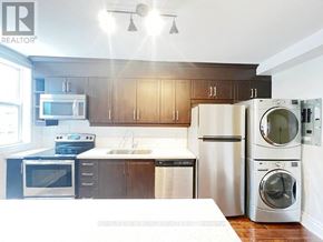 Toronto (Dovercourt-Wallace Emerson-Junction) apartment for rent - A modern kitchen with a white countertop and stainless steel appliances.