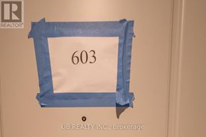 Ottawa condo for rent - A white door with a blue tape around it and the number 603 on it.