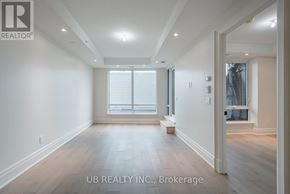 Ottawa condo for rent - A spacious room with wooden flooring and a window with blinds.
