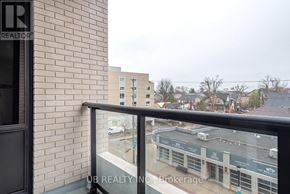Ottawa condo for rent - A balcony with a view of a parking lot and buildings.