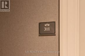 Ottawa condo for rent - A sign on a wall that says 311.