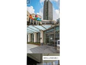 Burnaby apartment for rent - A modern building with a glass facade and a colorful sculpture in front.