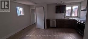 Toronto (Agincourt North) apartment for rent - A kitchen with a white door and a window.