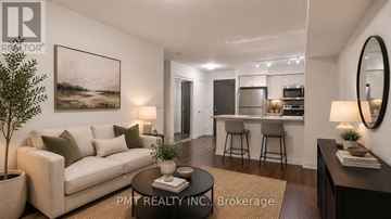 Toronto (Eglinton East) condo for rent - A well-lit living room with a couch, a coffee table, and a painting on the wall.