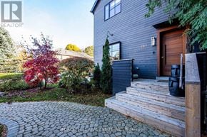 Toronto (Mount Pleasant East) apartment for rent - A house with a grey exterior and a wooden front door.