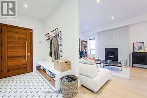 Toronto (Mount Pleasant East) apartment for rent - A room with a fireplace and a white couch.