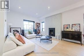 Toronto (Mount Pleasant East) apartment for rent - A living room with a white couch and a fireplace.