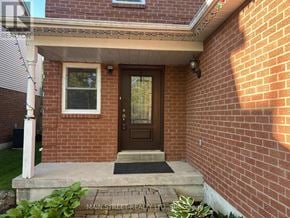Georgina (Keswick North) apartment for rent - A house with a brown door and a brick wall.