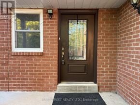Georgina (Keswick North) apartment for rent - A brown door with a glass window above it.