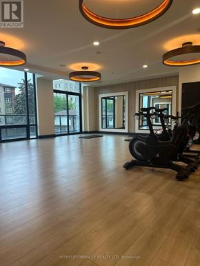 Waterloo condo for rent - A gym room with a treadmill and elliptical trainer.