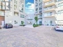 Toronto (Wexford-Maryvale) condo for rent - A car is parked in a parking lot in front of a white building.