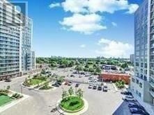Toronto (Wexford-Maryvale) condo for rent - A view of a parking lot surrounded by buildings and greenery.