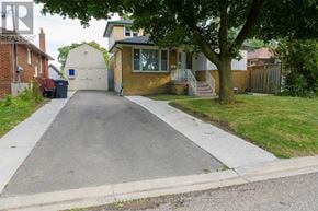 Brampton (Brampton North) apartment for rent - A residential street with a house and a tree in the foreground.