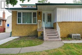 Brampton (Brampton North) apartment for rent - A house with a green lawn in front.
