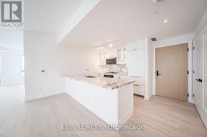 Toronto (Englemount-Lawrence) condo for rent - A modern kitchen with white cabinets and a marble countertop.