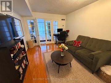 Toronto (Bay Street Corridor) condo for rent - A living room with a green couch and a coffee table.
