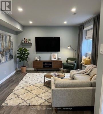 Caledon (Bolton West) apartment for rent - A living room with a flat screen TV mounted on the wall.