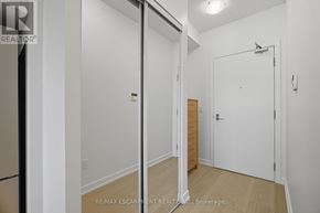 Mississauga (Central Erin Mills) condo for rent - A white room with a door and a mirror on the wall.