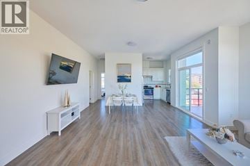 Maple Ridge apartment for rent - A spacious living room with a white sofa and a coffee table.
