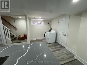 Toronto (Dorset Park) apartment for rent - A room with a white door, a window, and a washing machine.