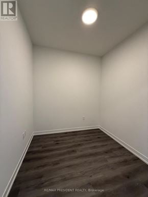 Vaughan (Vaughan Corporate Centre) condo for rent - A room with wooden flooring and white walls.