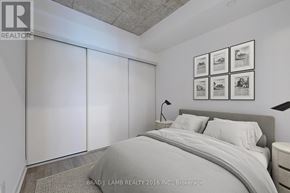 Toronto (Church-Yonge Corridor) condo for rent - A bedroom with a bed, nightstand, and pictures on the wall.