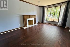 Pickering (Woodlands) apartment for rent - A room with a fireplace and wood flooring.