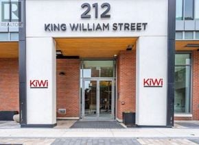 Hamilton (Beasley) condo for rent - The front of a building with the number 212 and the name King William Street on it.