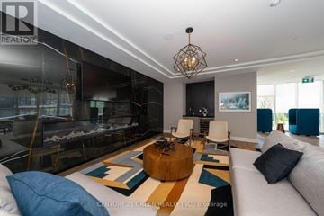Hamilton (Beasley) condo for rent - A living room with a fireplace and a rug on the floor.